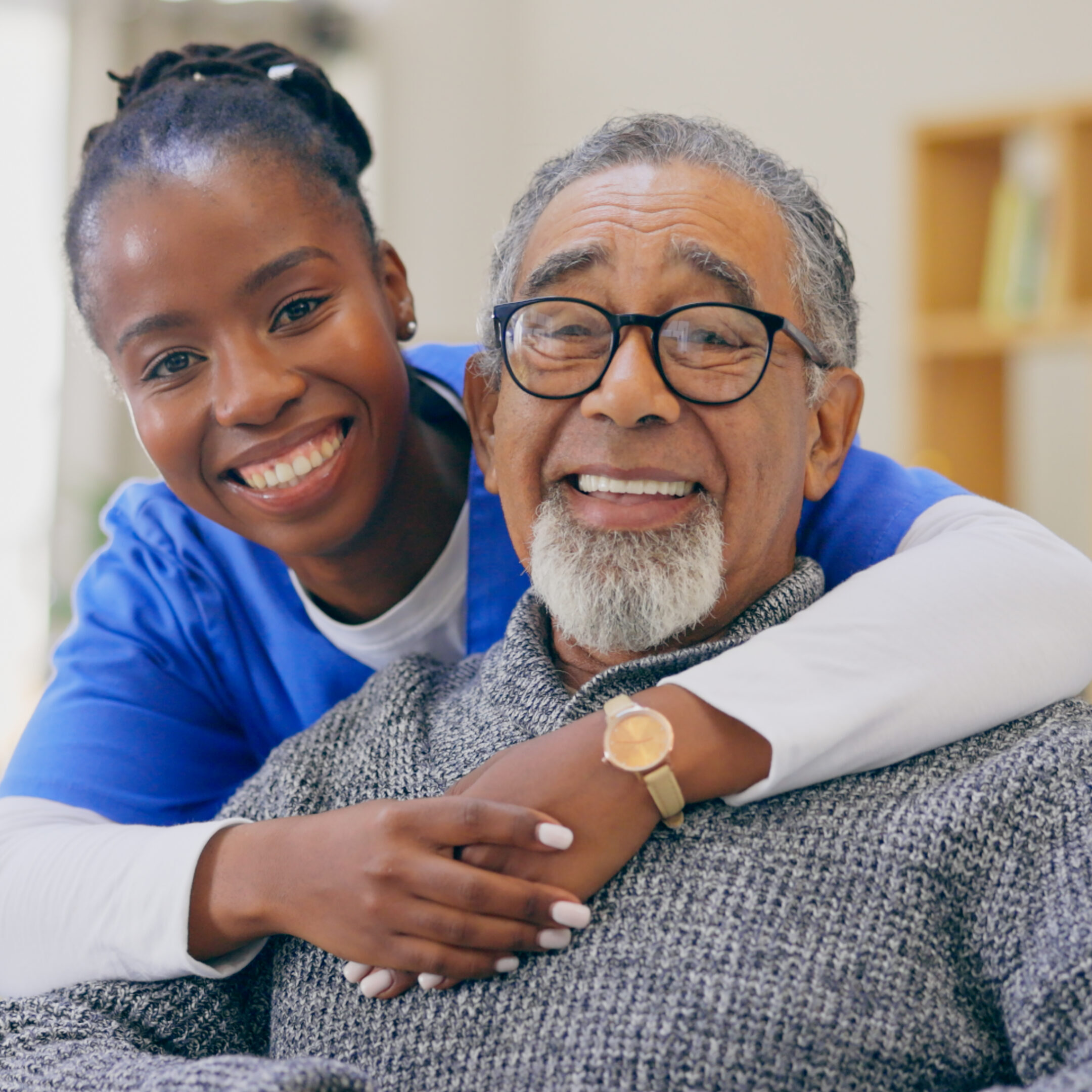 Senior man, nursing home and retired with hug, kind and care for support, caregiver and nurse. Happiness, healthcare and smile for medical, professional and worker for elderly, smiling or retirement